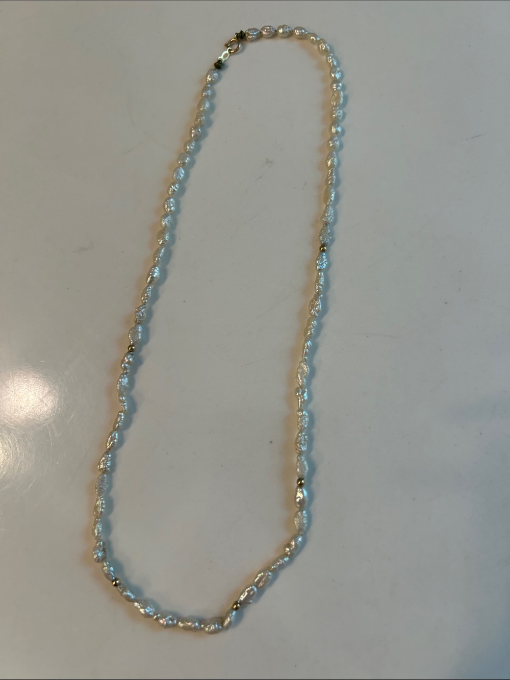 Delicate White Freshwater Pearl Necklace with Gold Accents
